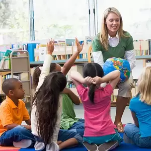 A School Teacher and Children in a school using commercial pest control services